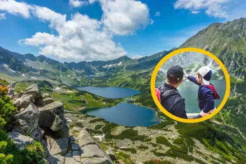Ojciec z synem podziwiają Tatry. Czy Dolina Pięciu Stawów jest odpowiednia na wycieczkę z dziećmi? Tak, to wspaniałe miejsce na rodzinne wyprawy.